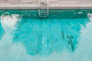 Copper stains on pool floor
