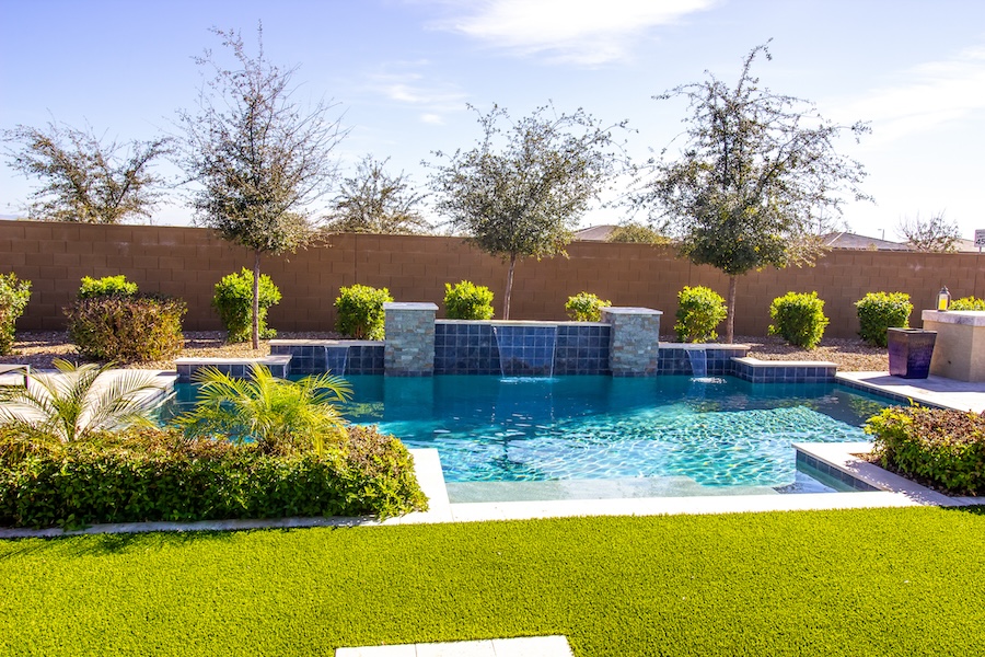 Modern Swimming Pool With Waterfalls IN Back Yard