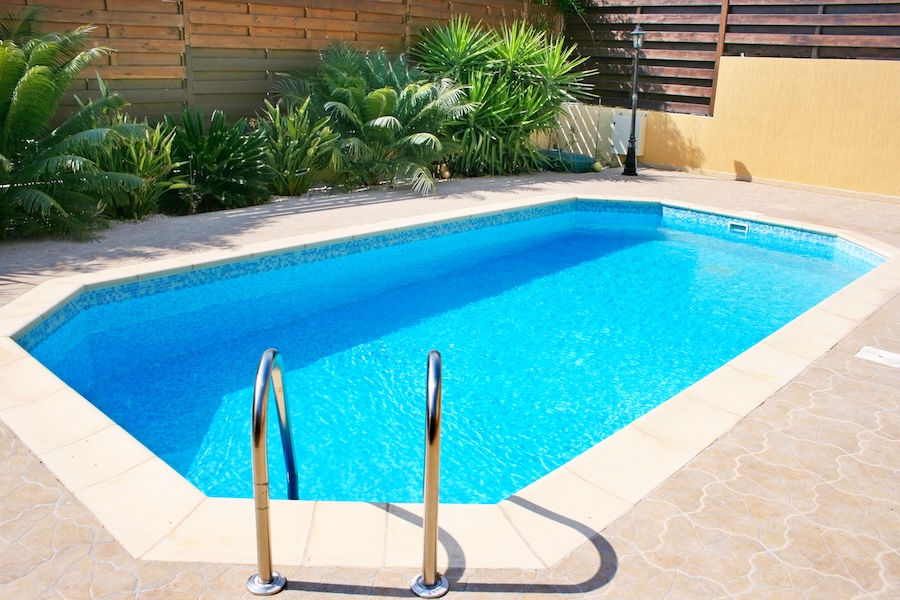 Swimming pool blue transparent water.