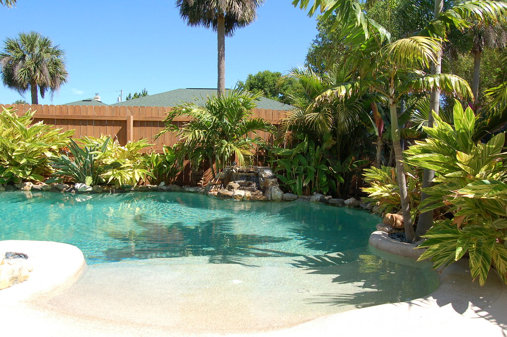 a pool with a beach entry